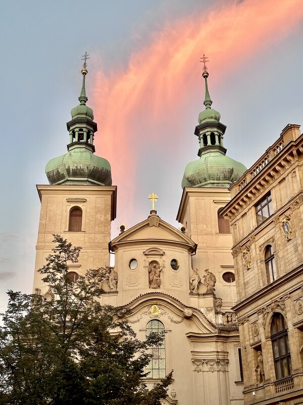 Katie’s original unedited photograph of green church domes beneath a coral sunset
