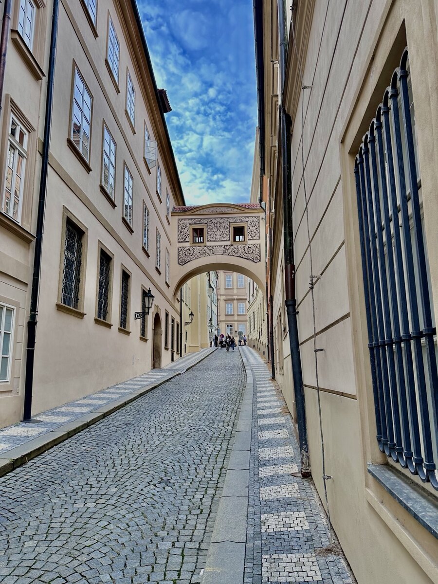 The decorated covered archway above Thunovská Street in Prague, Czechia