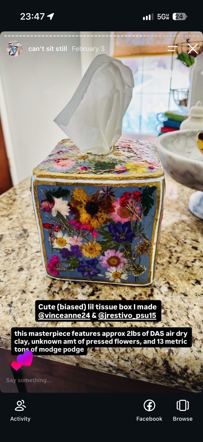 Handmade blue tissue box covered in pressed flowers with gold-colored edges, made as a bridal-shower gift